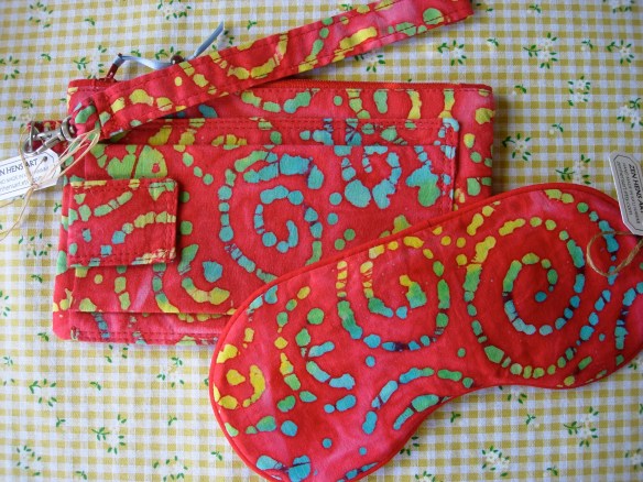 Wristlet purse with travel sleep mask.